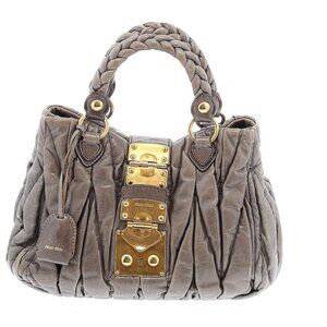 Miu Miu Matelassé in grey with gold hardware
